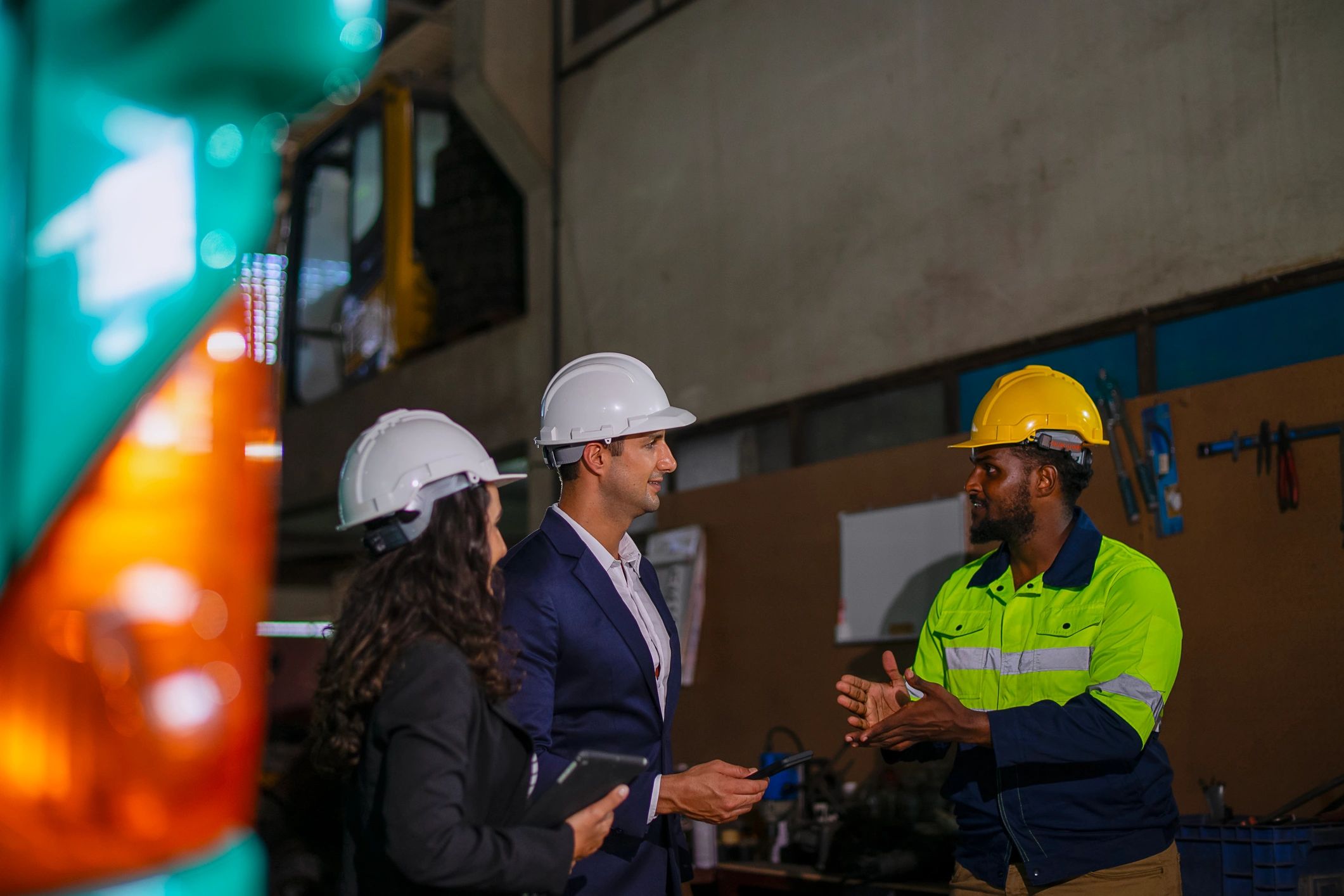 Engineering team in discussion at an industrial site