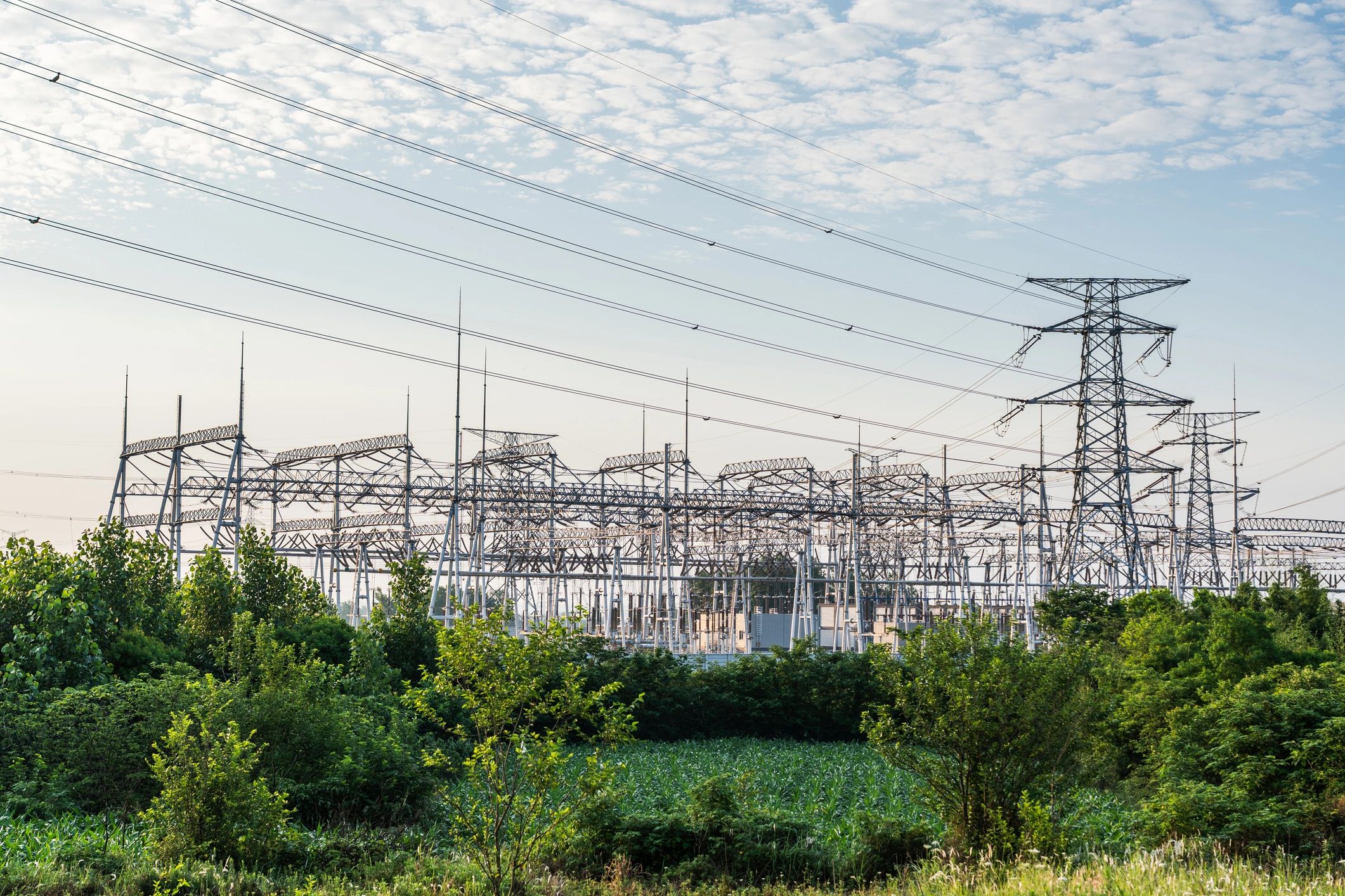 High-voltage electrical substation with transmission towers